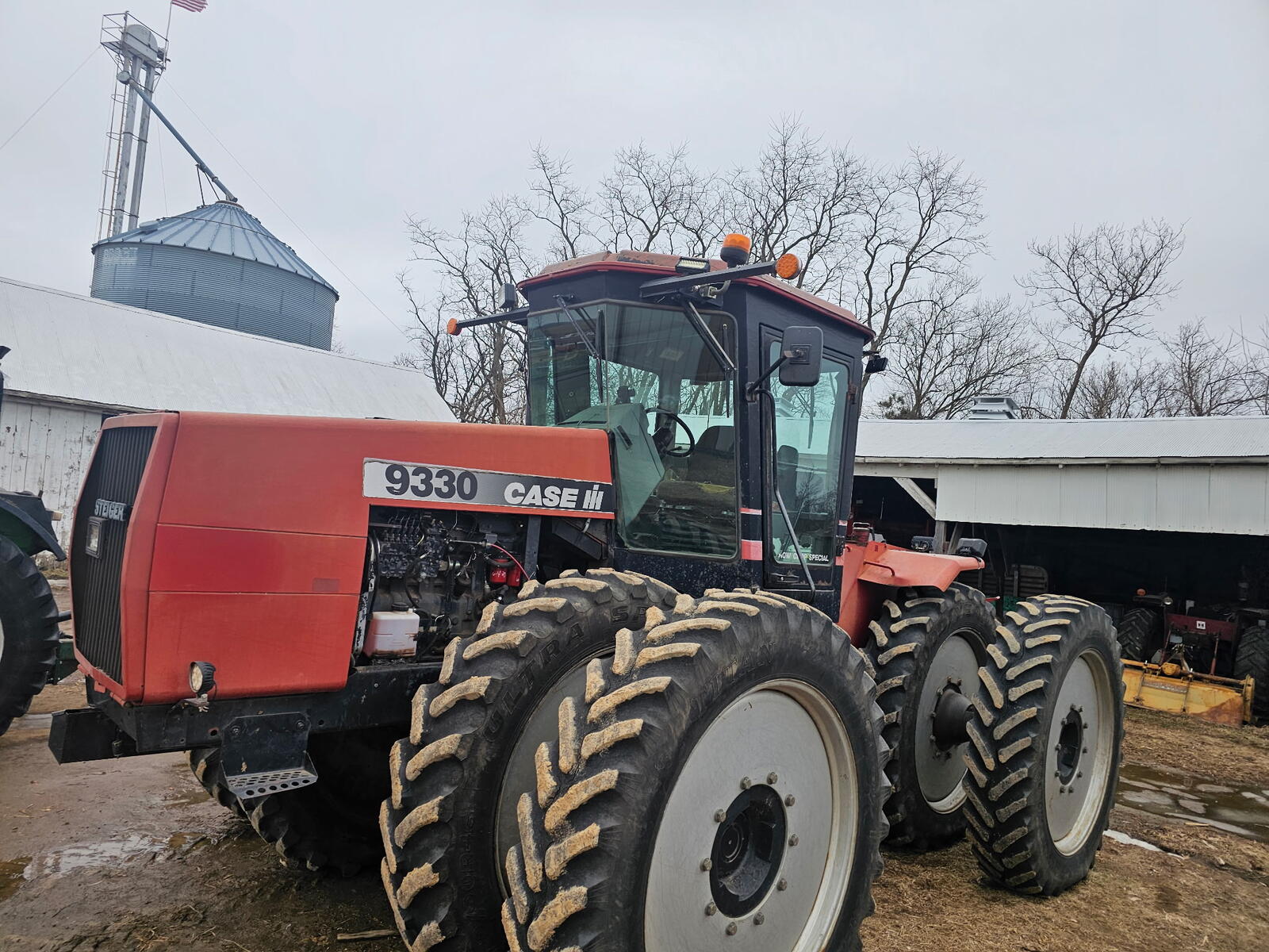 Case IH 9330 Steiger unfinished — yard with duals, hood open before refinishing